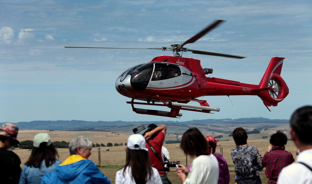 Danger to fly helicopter among public 12 apostles Great Ocean Road Australia