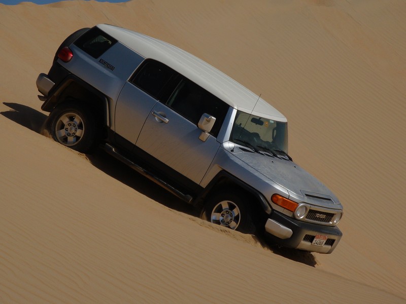 FJ cruiser in dune desert Abu Dhabi United Arab Emirates off road vehicle