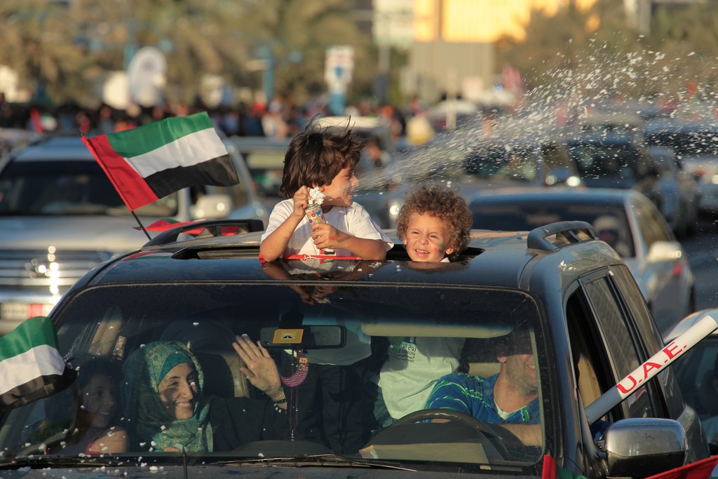 childrens on the car national day abu dhabi UAE car on the corniche abou dabi fete nationale
