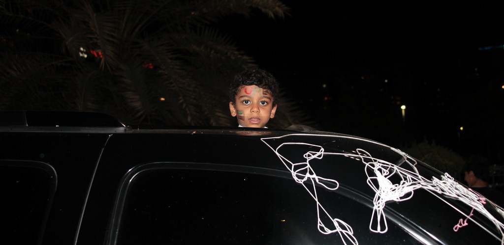 shy boy on the top of a car abu dhabi national day UAE spirit of the union