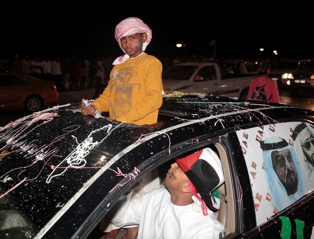 children top of the car national day abu dhabi 40th anniversary UAE