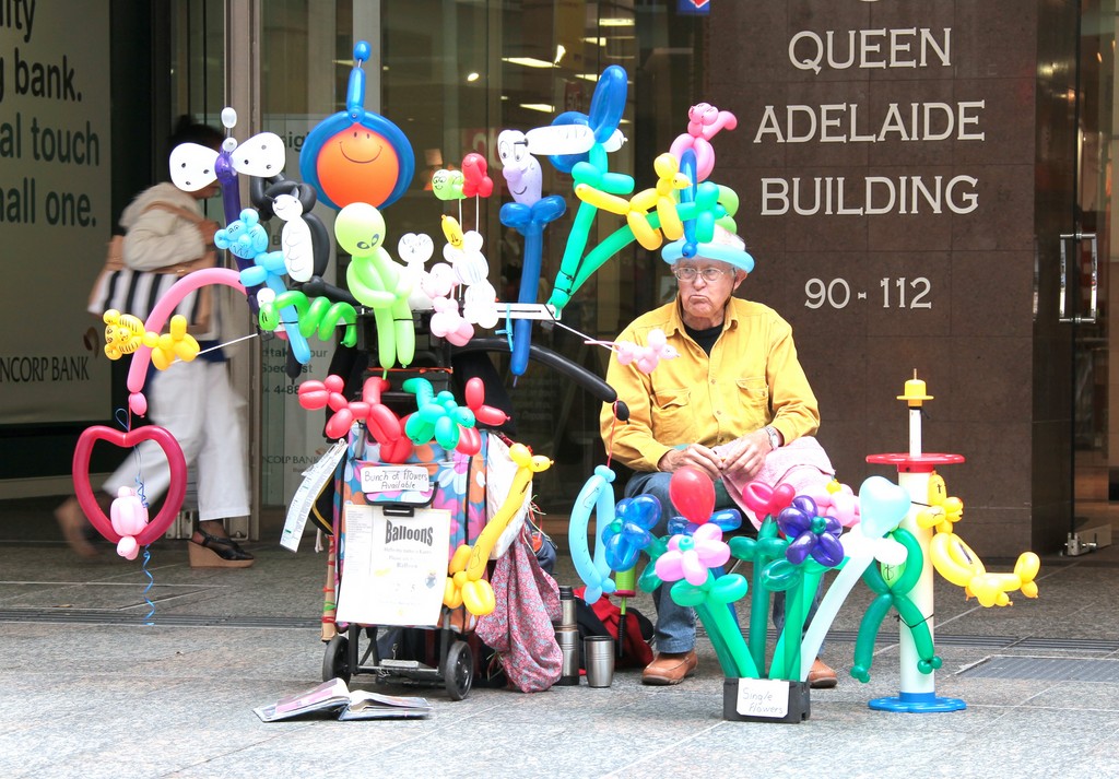 Queen Adelaid Building old man with balloons