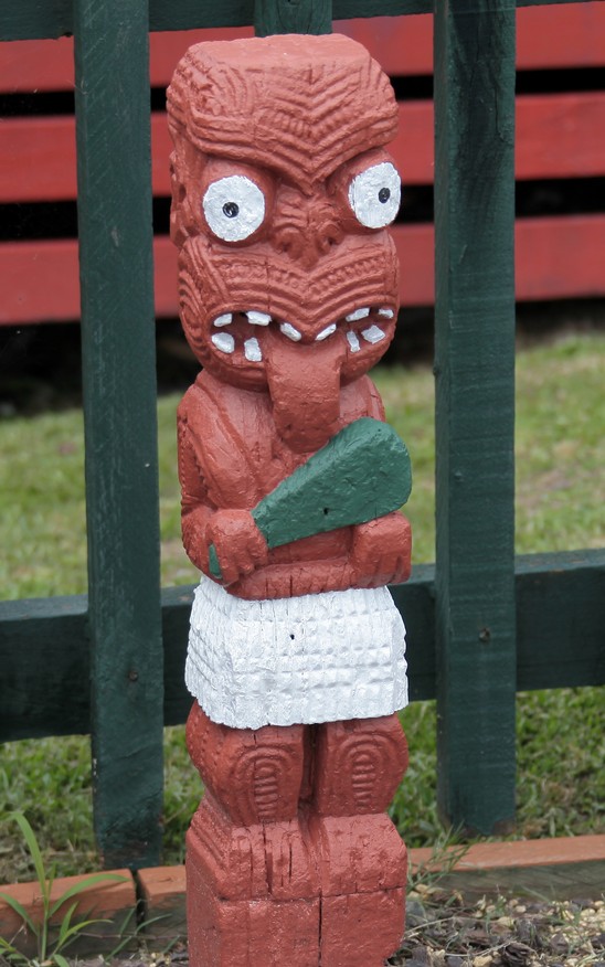 ugly moari statue in village new zealand north island