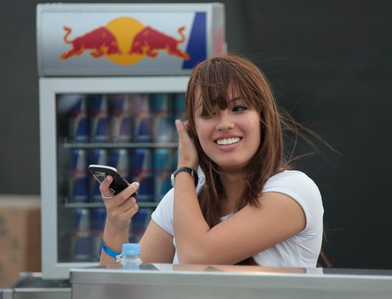 Red Bull smiling hostess sporting events and sponsorship