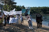 Manifestants Ensemble pour la planète bilan carbone de la Nouvelle-Calédonie Charbon SLN