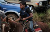 Jeune fille Kanak sur un cheval foire de Thio 2013 Nouvelle-Calédonie