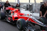 Nechanics pushing a F1 car Abu Dhabi Grand Prix pit lane United Arab Emirates