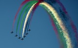 plane in the sky UAE national flag smoke green white red abu dhabi