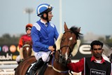 Abu Dhabi Equestrian club Jockey and his lad-driver