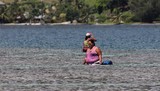 big woman fishing in the moorea lagoon french polynesia 