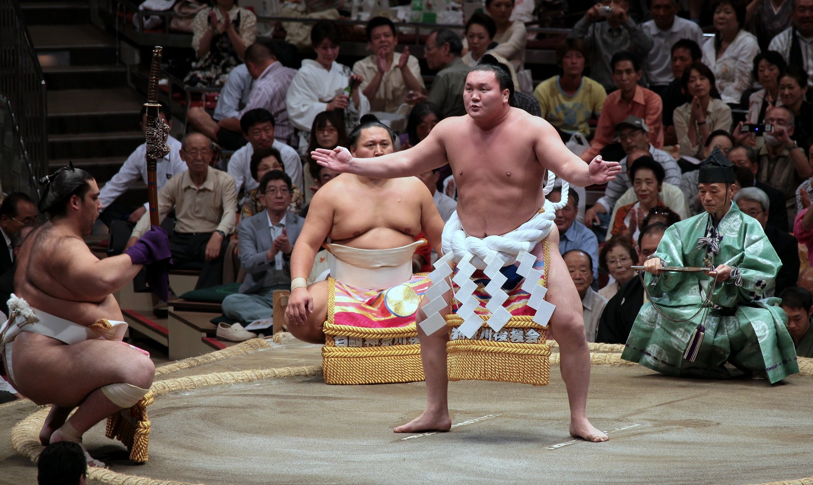 Yokozuna performing dohyo-iri ring-entering ceremony
