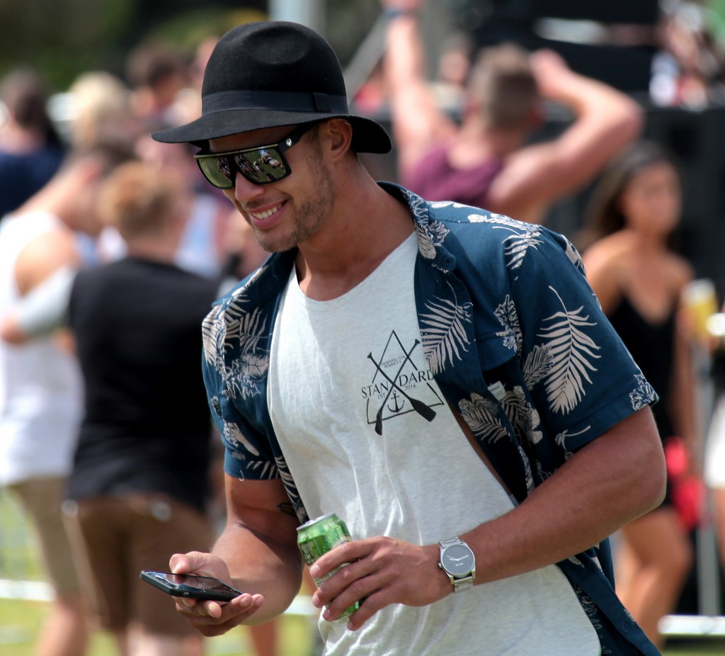 Male party dancing park front beach Melbourne Australia