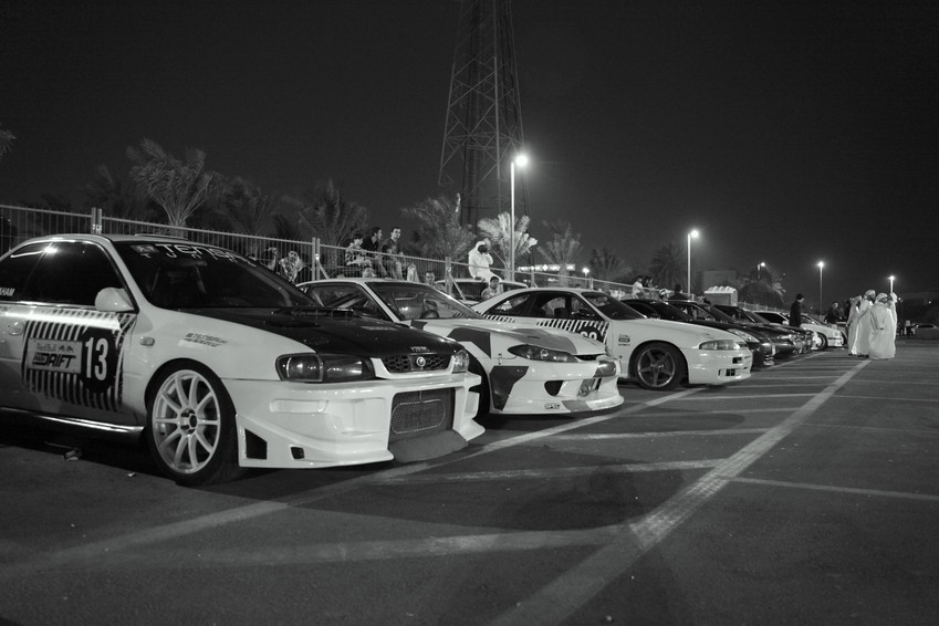 Red bull drift competition car park Abu Dhabi black and white picture